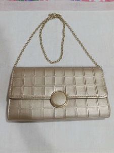 Mochi Gold Textured Clutch Bag