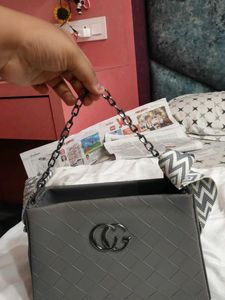 Stylish Grey Handbag with Geometric Strap