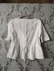 Chic White Lace-Up Peplum Top