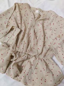 Chic Beige Heart Print Peplum Top