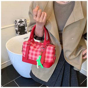 Chic Pink Plaid Handbag with Charm