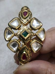 Elegant Gold Bangle with Green Stones