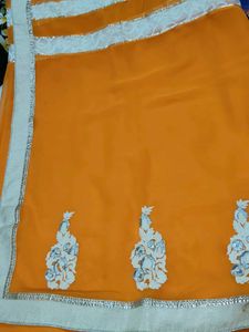 Orange Saree with Intricate Embellishments