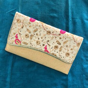 Embellished Peacock 🦚 clutch in jute finish..