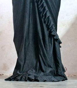 Selling a black color partywear stitched saree
