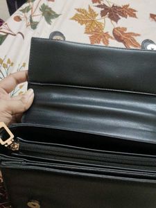 Chic Black Handbag with Buckle Detail