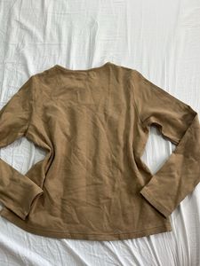 Brown long sleeve top with embroidered detail