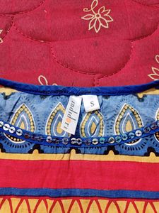 INDIDORI Brand, Multi Coloured Kurti With Beautiful 'chumki' Design On The Neck And Bottom Part.