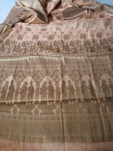 Elegant Peach Saree with Intricate Gold Print