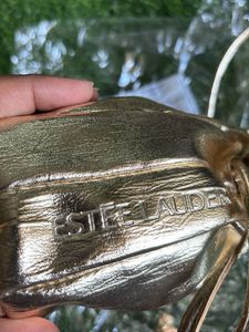 Estee Lauder Glamorous Gold Potli  Bag