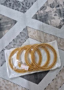 Set of 4 Gold Tone Bangles