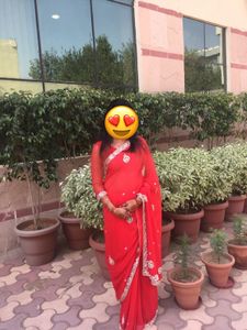 Vibrant Red Saree with Intricate Embellishments