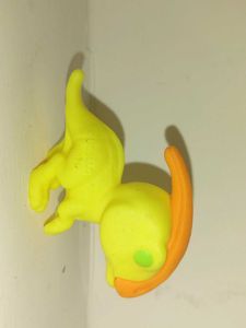 Yellow Toy Figure with Orange Hair