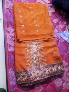 Elegant Orange Embroidered Saree
