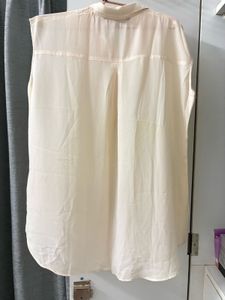 Elegant Cream Embroidered Sleeveless Blouse
