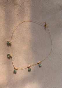 Elegant Gold Necklace with Gemstone Details