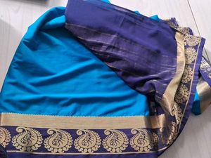 Elegant Teal Saree with Paisley Border