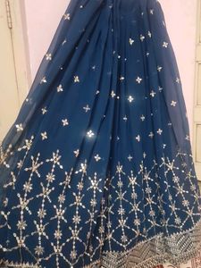 Stunning Teal lengha choli with Silver Embellishme
