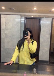 beige yellow shirt and heels