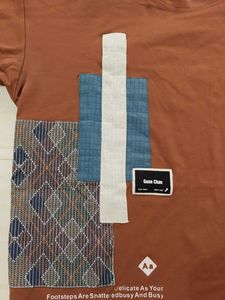 oversized Brown T-shirt with graphic patchwork art