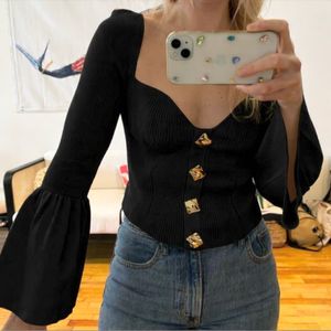 Chic Black Top with gold buttons