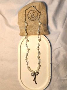 Elegant Pearl Necklace with Bow Charm