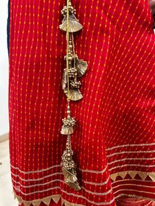 Red lehenga with matching dupatta and golden blous