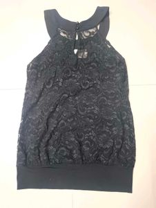 Black halter neck top.