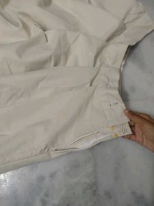 beige pleated skirt