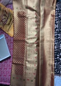 Beautiful Golden tissue saree with blouse piece