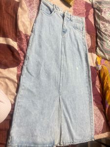 This is a light-wash denim midi skirt
