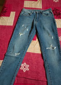 Distressed and flared Blue Denim Jeans