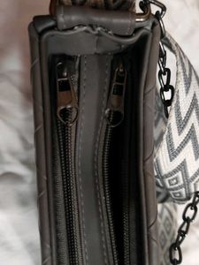 Stylish Grey Handbag with Geometric Strap