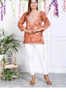 Embroidered Orange Kurti with White Pants