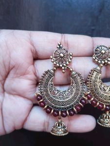 Antique Gold Jhumka Earrings with Red Beads