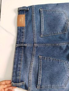 Flared Blue Jeans with Button Detail