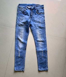 Distressed Blue Denim Jeans