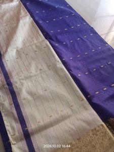 a purple saree with silver dotted design
