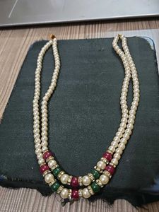Red, green and white pearl necklace