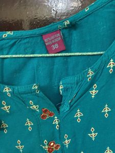 Ferozi blue jacketed kurta with beautiful print