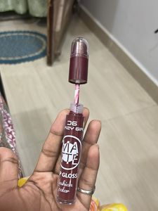 matte liquid lipstick with lip cryon on tip.