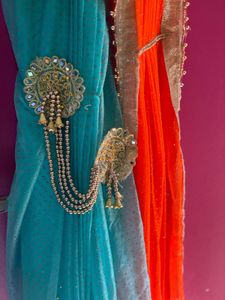 Stunning Blue and orange Net saree with Embellishm