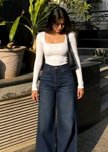 High-waisted, wide-leg denim jeans in a medium-to-