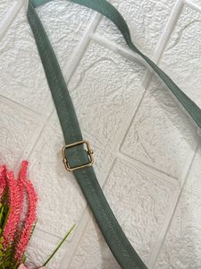 Green Roll shaped sling bag
