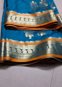 Elegant Teal and Gold Saree