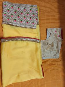 Synthetic yellow saree with stitched blouse