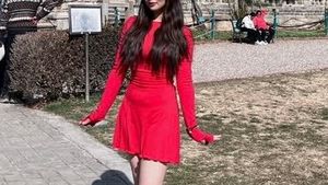 Rib knit long sleeve ruffle bodycon dress .