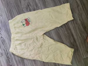 Bundle of baby clothes, beanie, shoes.