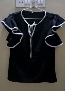 Elegant Black Top with White Accents