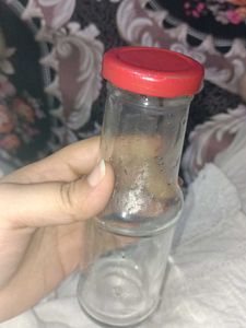 Glass Bottle with Red Lid